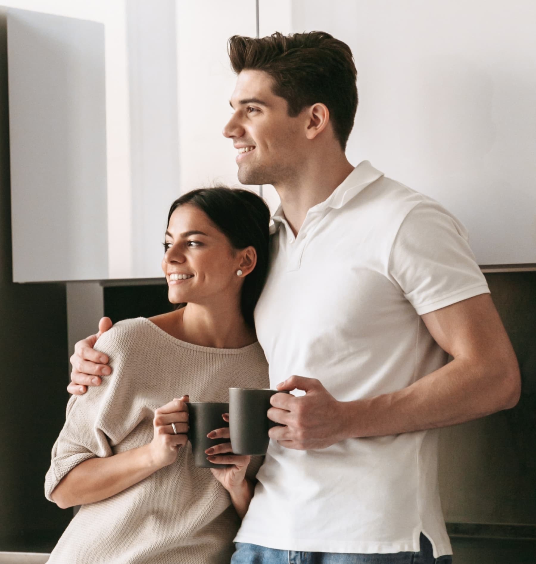 Man and woman embracing in Livana East Hanover apartment
