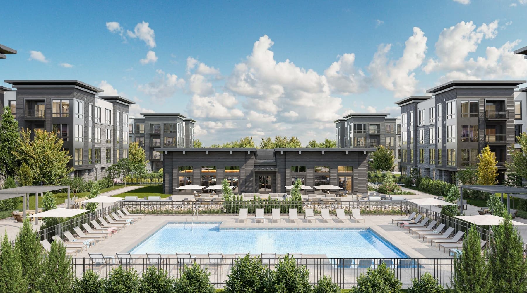 Livana East Hanover outdoor pool amenities with clubhouse, lounge chairs and residences in background