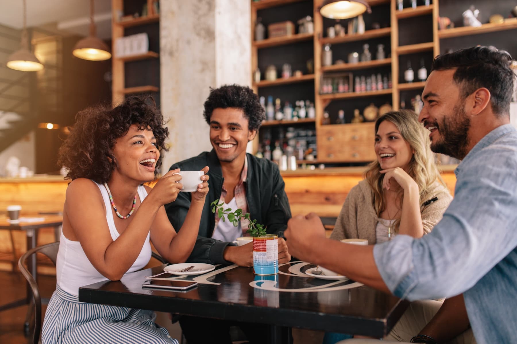 Four people enjoying coffee at Livana East Hanover