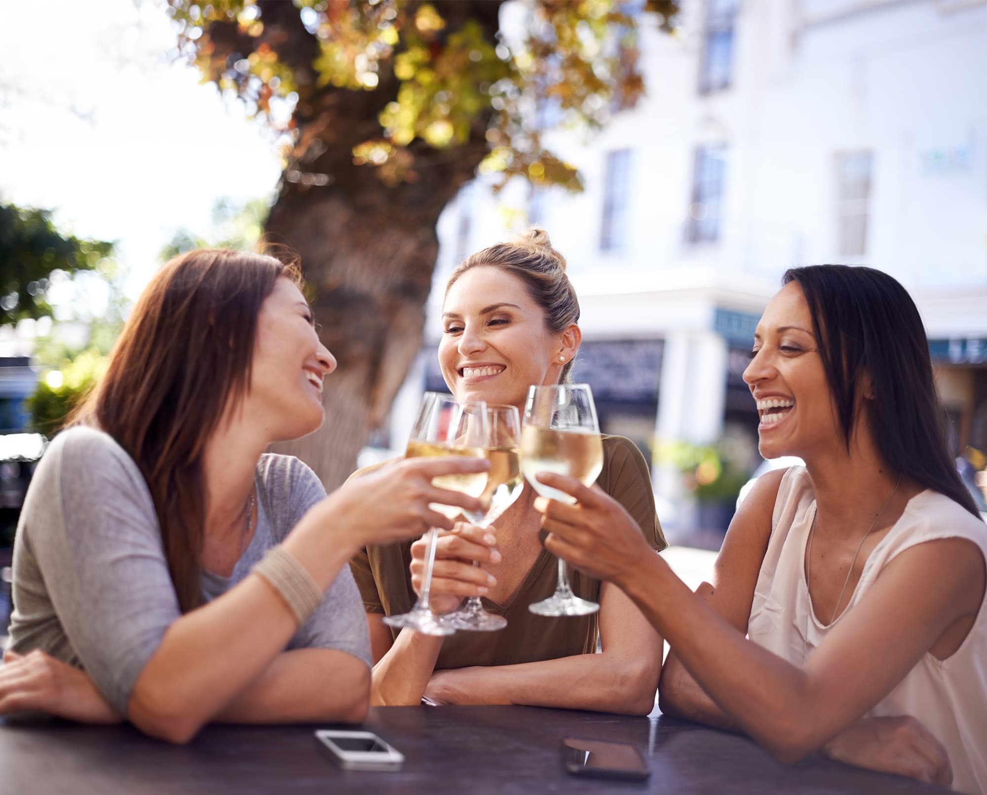 Three women enjoying wine in Livana East Hanover Neighborhood