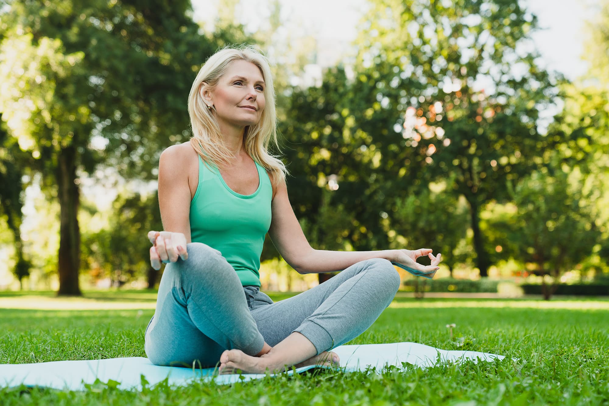 Woman practicing yoga outside at Livana East Hanover